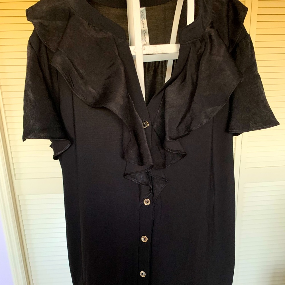 Beautiful black blouse with ruffles around the collar and on the sleeves